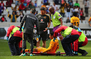 Kaizer Chiefs' striker Leonardo Castro lies on the ground injured during the Absa Premiership match against Cape Town City at Cape Town Stadium in Cape Town on September 15, 2018.