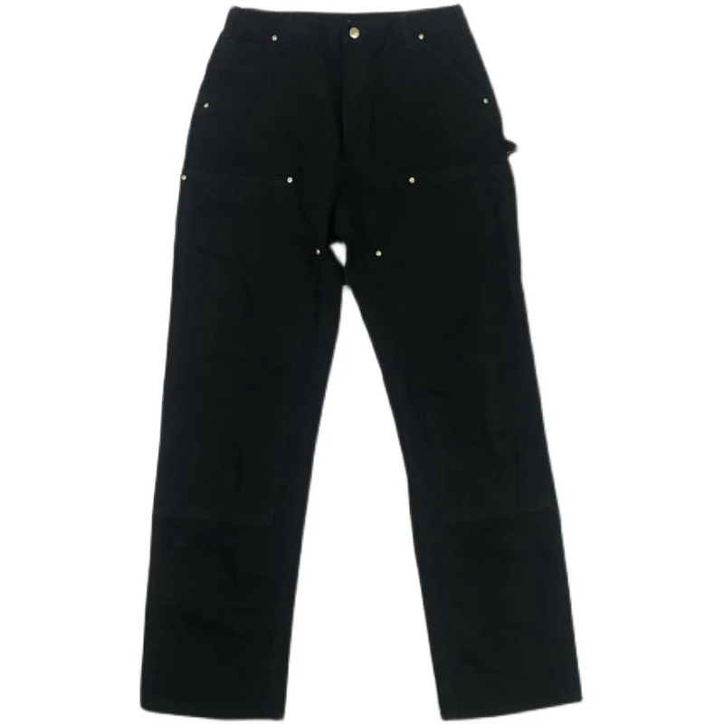 Salopette en toile double genoux lavée et usée. Confort et résistance pour tous les travaux. Un vêtement de travail durable et stylé pour l'homme moderne.