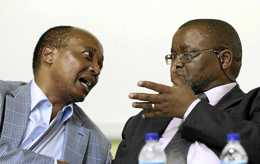 Mine owner Patrice Motsepe and Mineral Resources Minister Gwede Mantashe discuss a point during their visit to Modikwa mine in Burgersfort, Limpopo, where six workers were killed.