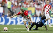 Luka Modrić of Croatia is challenged by Ngolo Kante of France during the 2018 Fifa World Cup final at Luzhniki Stadium in Moscow, Russia on July 15 2018. Modrić was the player of the tournament.