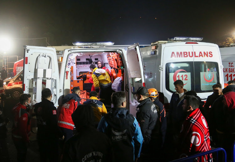 Medics and rescuers carry the body of a victim to an ambulance after an explosion at a coal mine, in Amasra in the northern Bartin province, Turkey October 15, 2022.