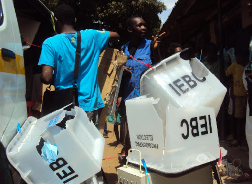 IEBC officials load some of the ballot boxes which were destroyed by the alleged Mombasa Republican Council group who raided St Andrews Primary school polling station in Malindi and attacked four security personnel in March Photo/File