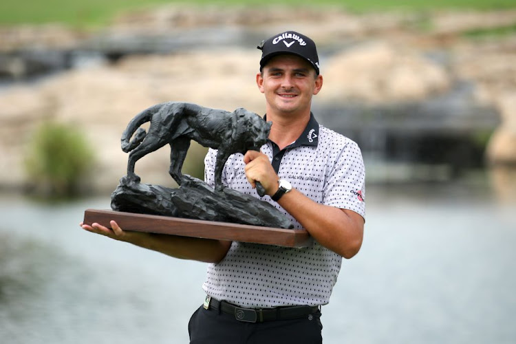 South African Christiaan Bezuidenhout celebrates after winning the Alfred Dunhill Championship at Leopard Creek Country Golf Club on November 29, 2020 in Malelane, South Africa