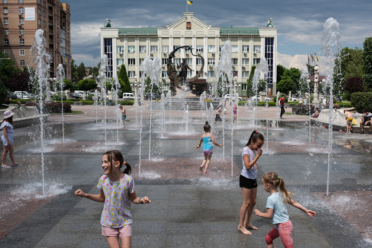 Children bathe in a reopened fountain on June 13, 2022 in Irpin, Ukraine. The region around Ukraine's capital continues to recover from Russia's aborted assault on Kyiv, which turned many communities into battlefields.