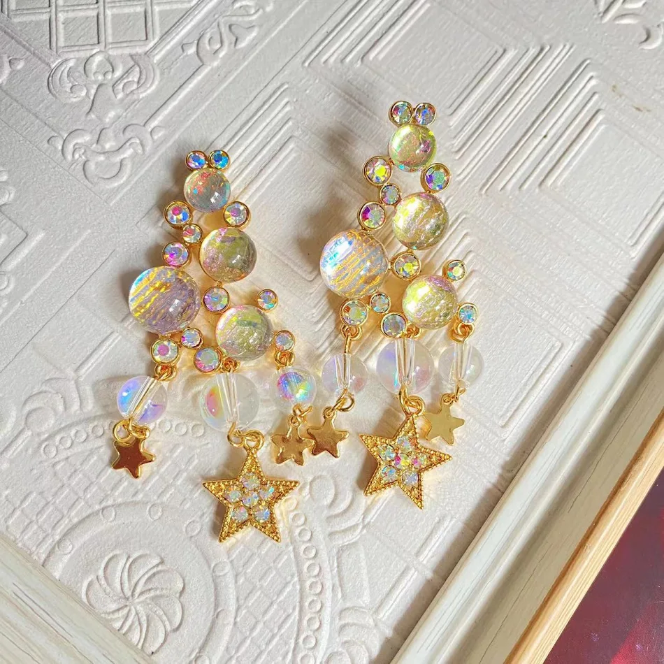 Elegantes pendientes de borlas de longitud media, diseño translúcido y dulce Starlight, perfectos para cualquier ocasión especial.