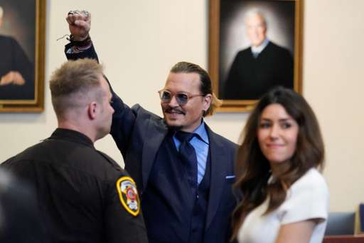 Johnny Depp, alongside his lawyer, gestured to court spectators last week after the closing arguments were made