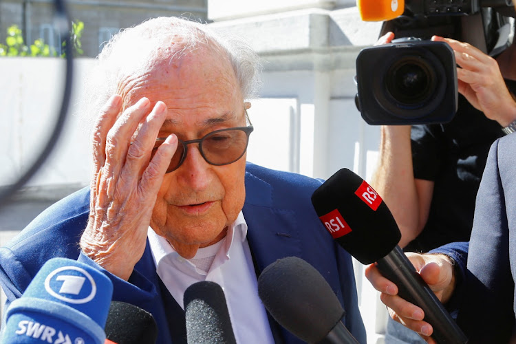 Former Fifa president Sepp Blatter talks to the media as he arrives at the Swiss Federal Criminal Court in Bellinzona, Switzerland, on July 8 2022. Picture: REUTERS/ARND WIEGMANN