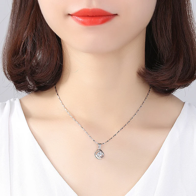 Collier avec pendentif amour rotatif en argent pur S999 rose, design japonais et coréen simple, élégant et romantique.