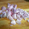 Thumbnail For Peeled Shallots Cut In Half And Diced.