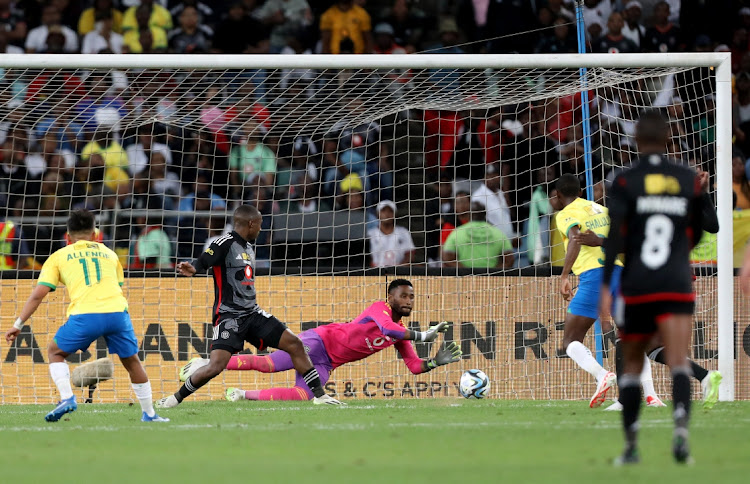 Orlando Pirates goalkeeper Sipho Chaine makes a save in MTN8 final against Mamelodi Sundowns at Moses Mabhida Stadium in Durban on Saturday.