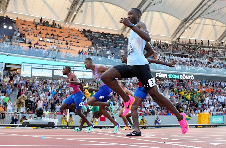 Noah Lyles of the US crosses the line to win the men's 100m final ahead of second-placed Botswana's Letsile Tebogo and third-placed Britain's Zharnel Hughes.