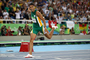 Wayde van Niekerk of South Africa reacts after winning the Men's 400 meter final on Day 9 of the Rio 2016 Olympic Games at the Olympic Stadium on August 14, 2016 in Rio de Janeiro, Brazil.  (Photo by Cameron Spencer/Getty Images)