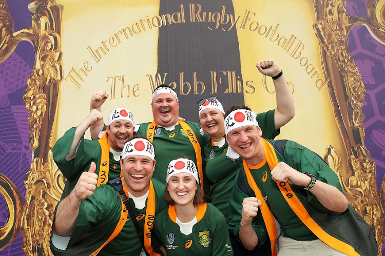 South Africa fans pose in front of a Webb Ellis Cup picture before the Rugby World Cup 2019 Group B game between South Africa and Namibia at City of Toyota Stadium on September 28, 2019 in Toyota, Aichi, Japan.