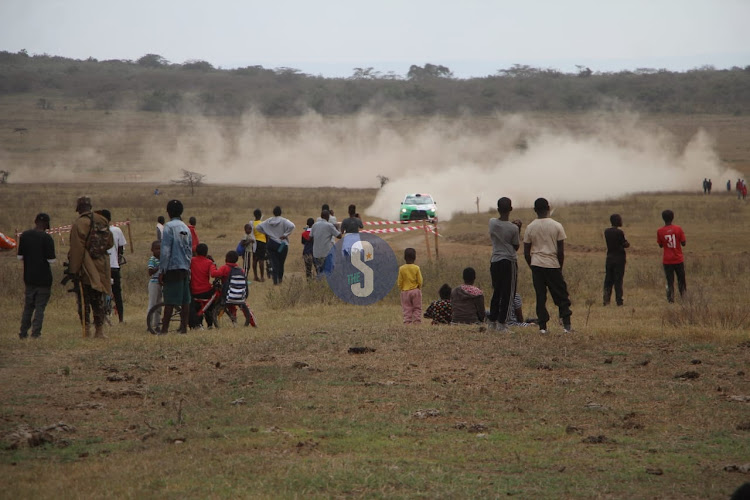 Kenyans watching the WRC Safari Rally 2024 1st round at Elementaita Soysambu view point on March 30, 2024.