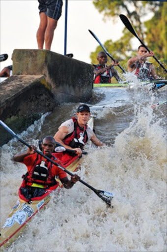 Siseko Ntondini and Piers Cruickshanks navigate through rapids.