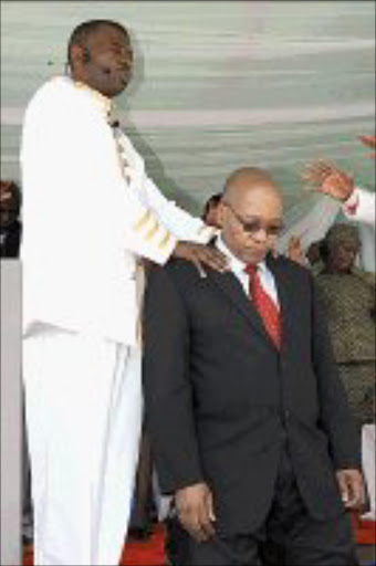 BLESSED REDEMPTION: Leader of Tyrannus Apostolic Church, Tshitso Mokoena, prays for ANC deputy president Jacob Zuma. Pic. Lucky Nxumalo. © Sowetan.