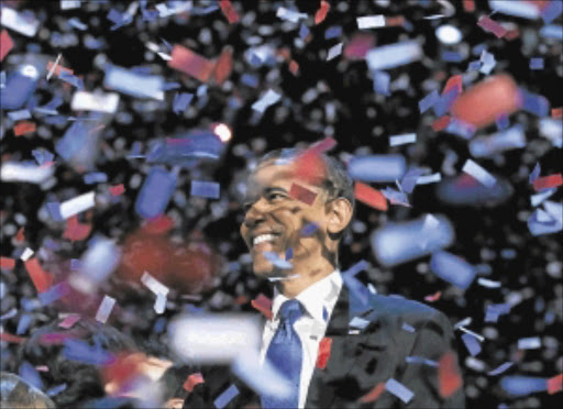 VICTORIOUS: US President Barack Obama celebrates as confetti falls after his victory speech in Chicago. Photo: REUTERS