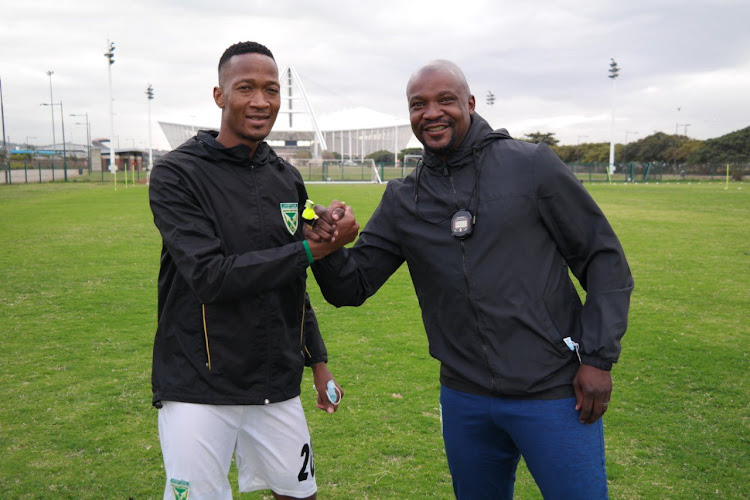 New Lamontville Golden Arrows coach Lehlohonolo Seema poses with the club's captain Matome Mathiane.