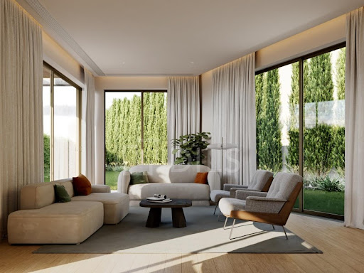 Modern living room with fireplace and garden in this luxury property for sale in Aldoar, Foz do Douro e Nevogilde ($1,193,098 - 114 m²)