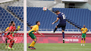 SA Under-23 centreback Luke Fleurs looks on as France striker Andre-Pierre Gignac heads in a goal.