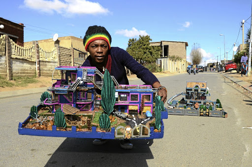 Mveliso Ntaba is an artist that recycles cardboard and plastic to make architectural structures.