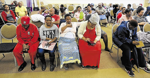 RELIEF: Some of the parents are seen here at the teachers institute centre at Stirling High School, where the department of education was placing about 100 pupils still not in the system Picture: STEPHANIE LLOYD