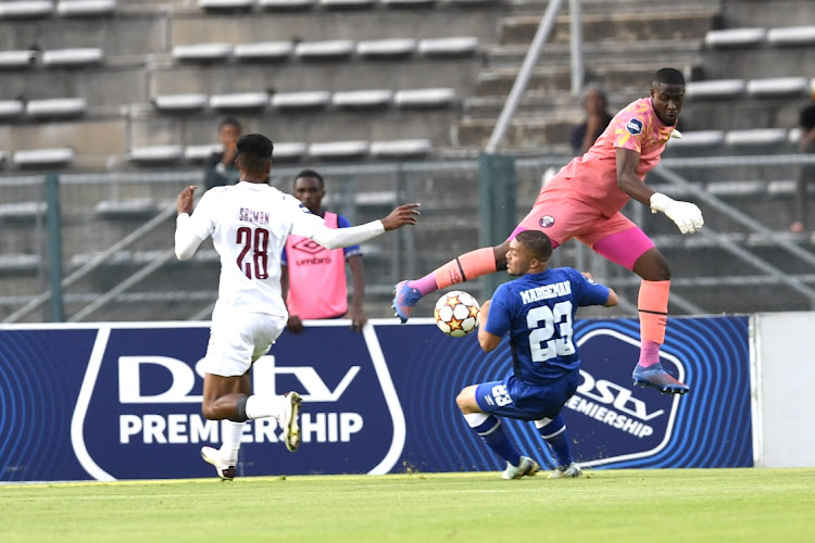 Thakasani Mbanjwa of Swallows FC saves the ball from Grant Margeman of SuperSport United during the DStv Premiership match between SuperSport United and Swallows FC at Lucas Moripe Stadium.