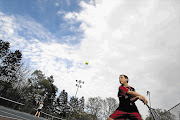 SMASH HIT: As a member of the fifth team at school 'I had an unplayable serve. Mostly it was I who was unable to play it, but when it came off, by God, it burned cauterised holes through chicken-wire fences'