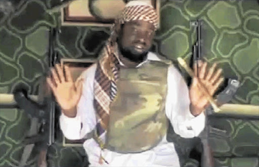 Abubakar Shekau, leader of Nigeria's militant Islamic group Boko Haram, seen in a 15-minute video address and entitled 'A Message to President Goodluck Jonathan'. In it, Shekau said his supporters were at war with Christians and said Nigerian security forces were powerless to defeat the group.