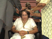 Pastors in Langa lay hands on Patrica Lille as they pray for her on Sunday. 