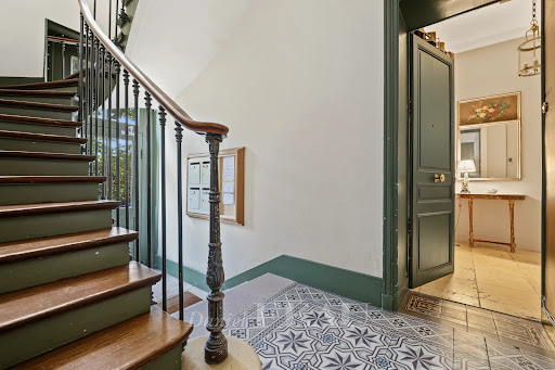 old staircase, open door, decorated entrance in this luxury apartment / penthouse for sale in Versailles ($1,673,744 - 150 m²)
