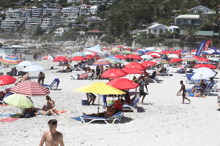 Local travelers like these holiday makers at Clifton beach in Cape Town buoyed the tourism sector in December, but international and business travel still remains subdued. Picture: Esa Alexander