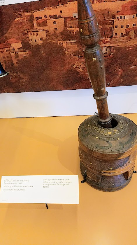 Music Instrument Museum (MIM) Geographic galleries, Mihbaj, mortar and pestle, from the Bedouin people; mulberry and bootoom wood, metal. Used by Bedouin men to crush coffee beans and to play rhythmic accompaniment for songs and dances