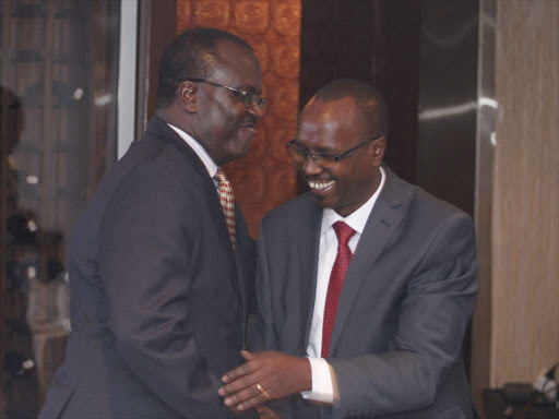 Association of Insurance Brokers of Kenya Nelson Omolo with AMACO managing director John Tomnor during their monthly meeting in Nairobi on September 29,2017.PHOTO/ENOS TECHE.