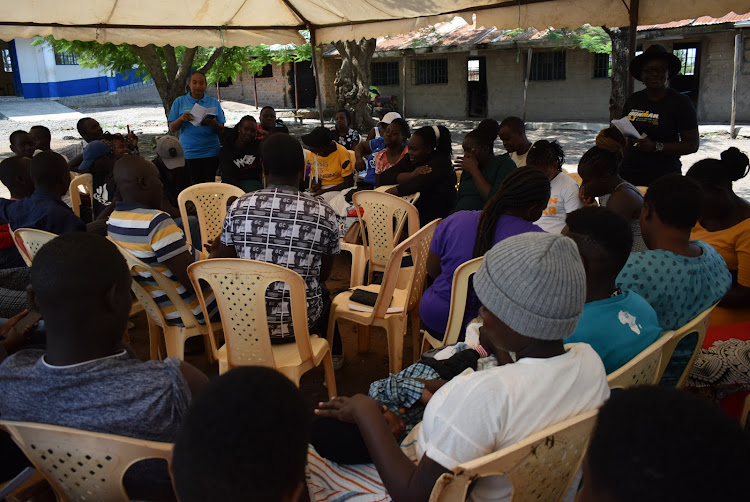 Gender activists Basra Dahir and Leon Otieno with youths at Shauri Yako in Homa Bay town on December 9,2023