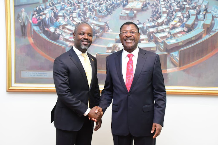 Speaker of the National Assembly Moses Wetang'ula with an official from the Conference of Speakers and Presiding Officers of the Commonwealth at the Parliament of Australia on Wednesday January 4 2023