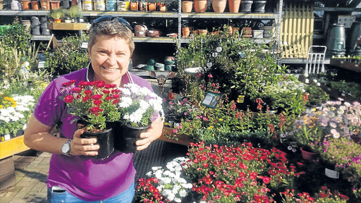 WELL GROUNDED: Television garden show host Tanya Visser, who is also editor of The Gardener magazine, was in East London at Builders Express DIY Centre this week to chat about the joys of gardening Picture: BARBARA HOLLANDS