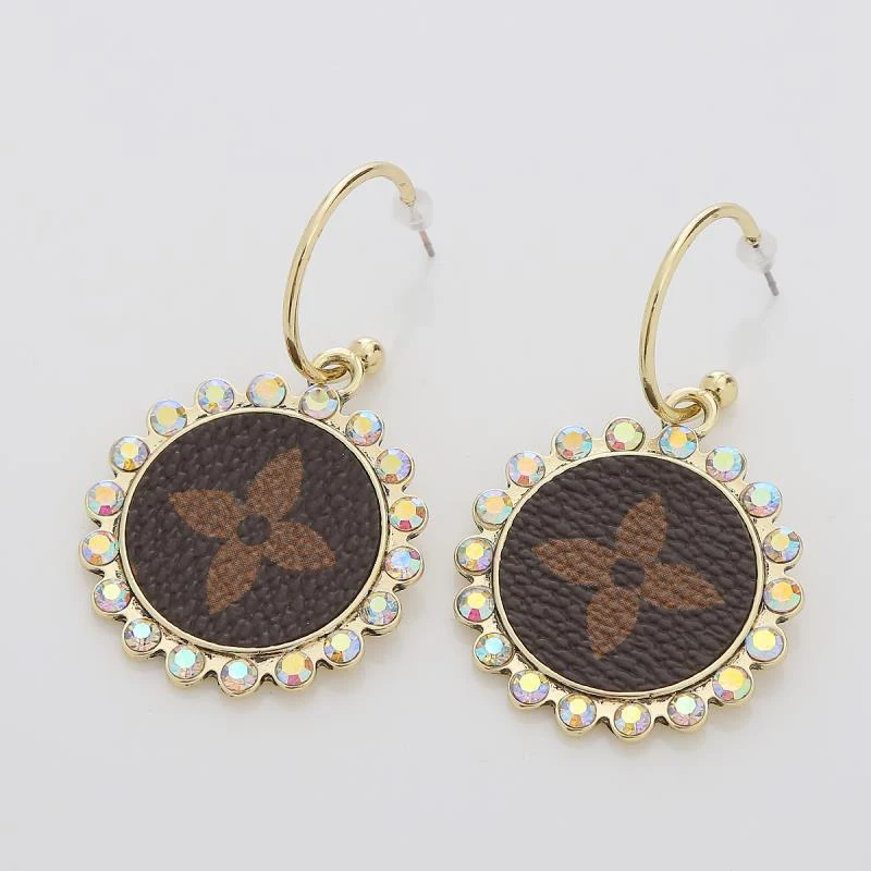 Orecchini in pelle PU a goccia double face con stampa leopardata