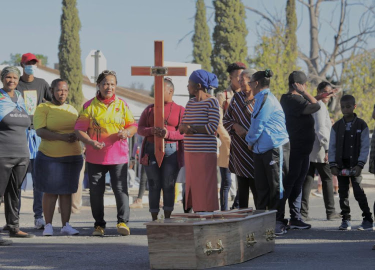 Protesters in Klawer with a coffin and a cross on April 26 2022.