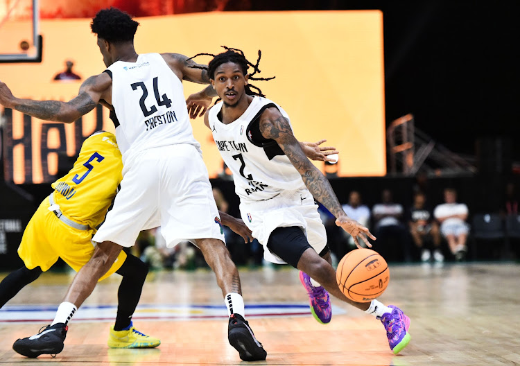 Cartier Diara of Cape Town Tigers is challenged by Childe Dundao of Petro de Luanda during the 2024 BAL Season 4 match at the SunBet Arena in Pretoria on March 16, 2024