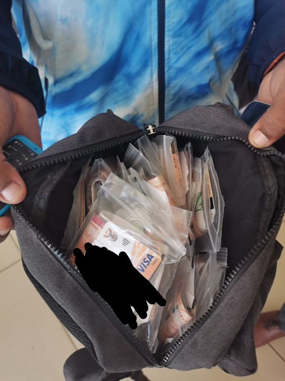 The two suspects were seen withdrawing money using various Sassa cards at an Absa machine near the Spar at Thabong Mall.