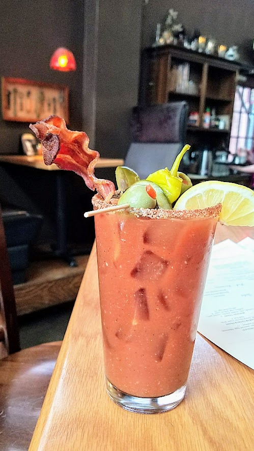 Circa 33 brunch, Bloody Mary c.1921 with vodka, summer-spiced bloody blend, creole-salt rim and choice of bacon/veggie/combo garnish