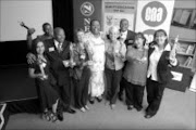 OUTSTANDING ACHIEVEMENT: Representatives of the winning schools in the Readthon 2006 competition and Education Minister Naledi Pandor, centre, at the awards ceremony at the READ Education offices in Pretoria last month. © Sowetan.