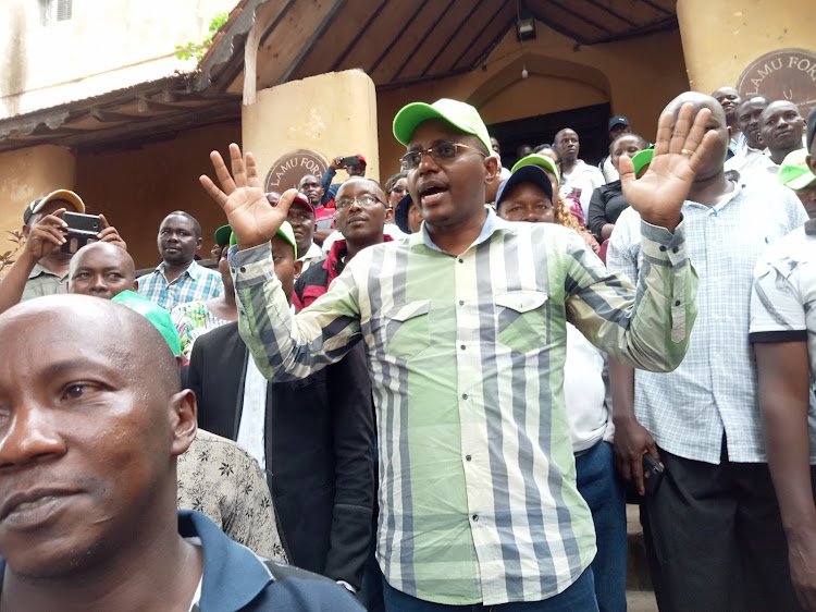 Former Lamu Deputy Governor Eric Mugo of Narc Kenya adrresses supporters at the Mkunguni square in Lamu Island shortly after his clearance by IEBC.