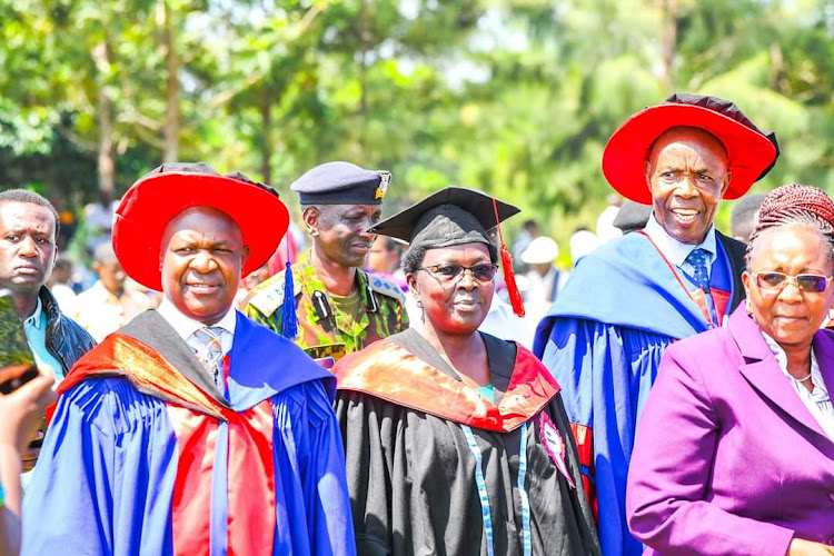 Kisumu deputy governor Dr Mathews Owili with the Kisumu National Polytechnic Chief principal Catherine Kelonye and Education Cabinet Secretary Ezekiel Machogu during the graduation ceremony of 4,023 graduates on Friday.