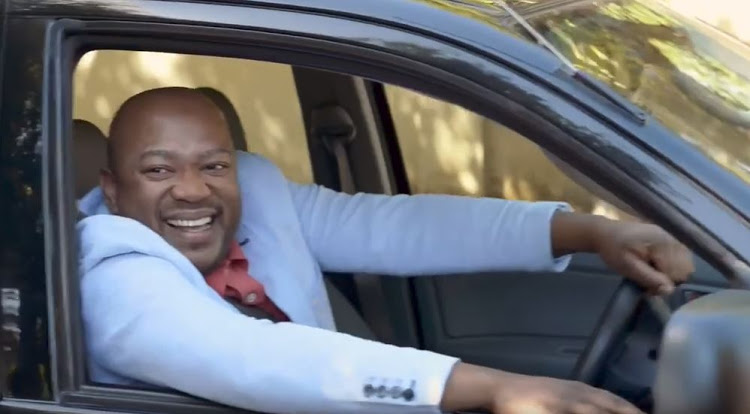 The jealous black neighbour in kulula.com's 'Don't be a travel hater' ad, shortly before he drives over a white couple's luggage.