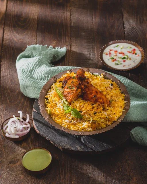 Dum Chicken Biryani Served With Raita & Salad