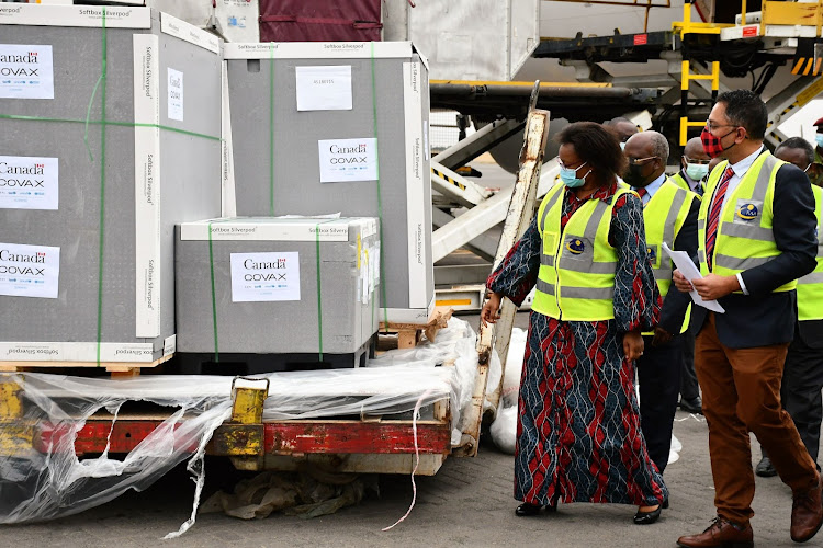 Health PS Susan Mochache and the Ag Canandian Ambassador to Kenya David Anthony Da Silva during the arrival of a consignment of 358,200 doses of AstraZeneca vaccine from the Canandian Government under the Covax facility at JKIA on September 2, 2021.