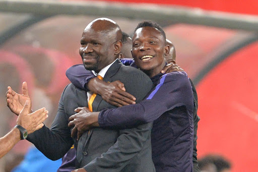 Kaizer Chiefs assistant coach John Pantsil (R) celebrates with head coach Steve Kompela (L) during the Absa Premiership match against Mamelodi Sundowns at FNB Stadium on April 01, 2017 in Johannesburg, South Africa.