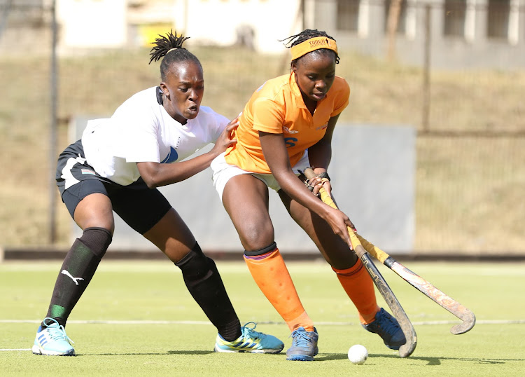 Wolverines' Pauline Ochieng shields the ball from Nelly Adhiambo of Amira Sailors during a KHU Premier League clash at City Park Stadium